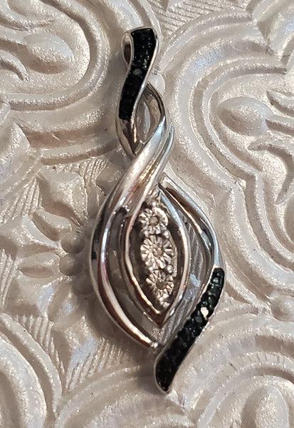 Sterling Blue and White Diamond Pendant: Please see the pictures for exact details as this is the item you will receive.Ã‚ Measurements: has a 33.8mm drop and is 12.2mm wide Weight in Grams: 3.66 Hallmarks and Stamps: 925, unknown Other:�