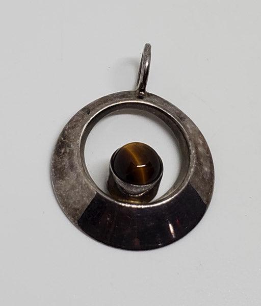 Finland Tigers Eye Sterling Silver Pendant: Please see the pictures for exact details as this is the item you will receive.Ã‚ Measurements: 31.7mm drop and 23.5mm wide Weight in Grams: 2.8 Hallmarks and Stamps: 925, Finland Other: Tested Due