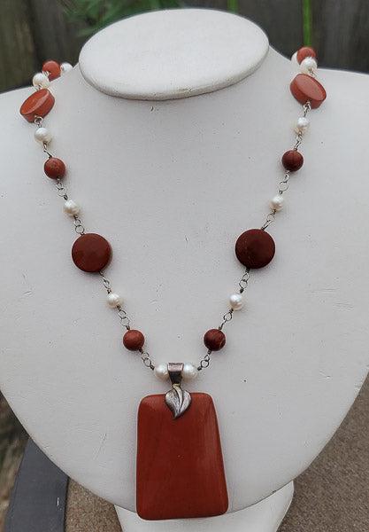 Jasper and Pearl Beaded Sterling Necklace: Length: 20 inchesÃ‚ long. Jasper pendant has a 59.7mm drop and jasper beads are 15 and 8mm. Pearl Beads are 6.5mm. All set on sterling silver. Weight in Grams: 61.12 Hallmarks and Stamps:Ã‚ 925