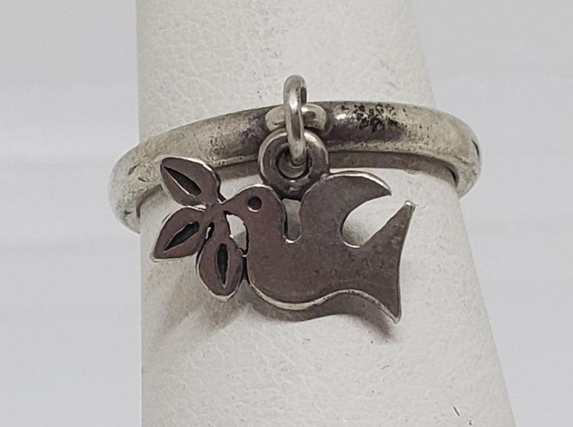James Avery La Paloma Sterling Charm Ring: Please see pics for details as this is the exact item you will receive.Ã‚ Size: 4.5 Item Details: The ring is retired the charm is not Weight in Grams: 2.21 Hallmarks & Stamps Include: 925, Ave