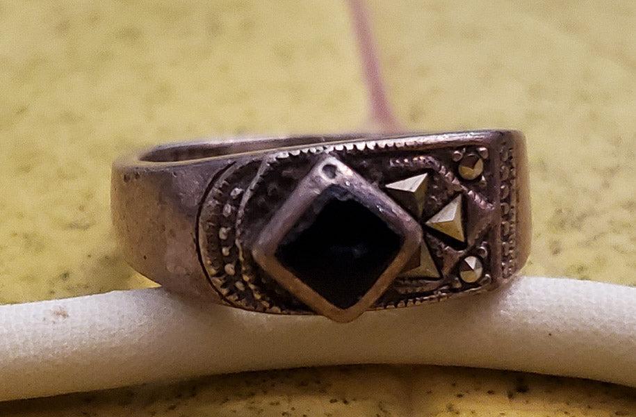 Onyx and Marcasite Sterling Silver Ring Sz 6.75: Please see pics for details as this is the exact item you will receive. Size: 6.75 Measures: 7.8mm at widest Weight in Grams: 6.09 Hallmarks & Stamps Include: 925 Please note: All items are taken 
