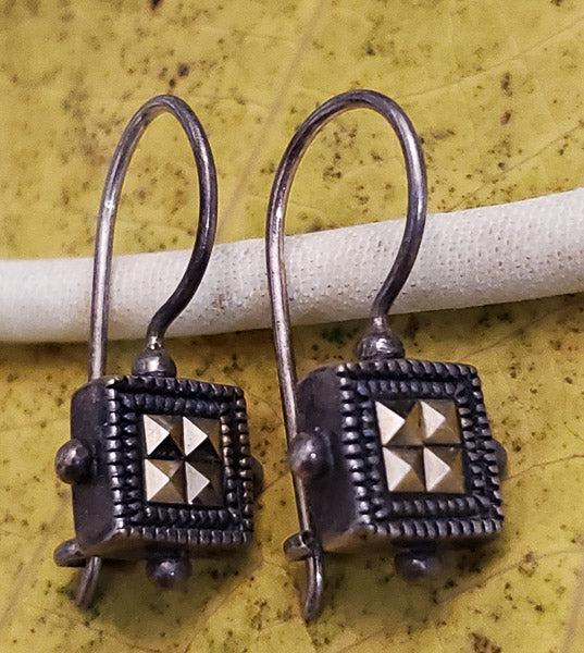 Marcasite Sterling Silver Earrings: Please see pics for details as this is the exact item you will receive.Ã‚ Measures: 21mm drop and 10mm wide Weight in Grams: 3.14 Hallmarks & Stamps Include: 925, Thailand Please note: All item