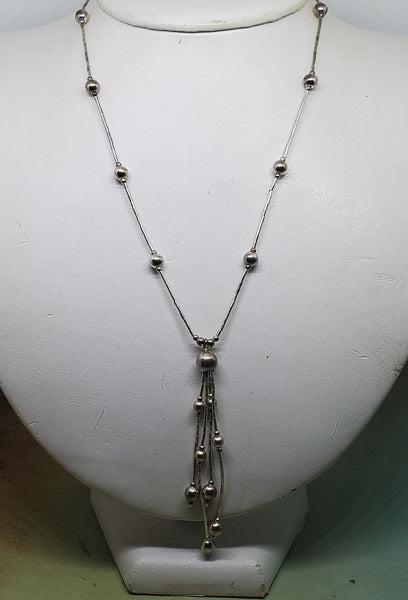 Sterling Silver Lariat Bead Tassel Necklace: Please review the pictures in detail as they are a major part of our description. The item pictured is the exact item you will receive.Ã‚ Length: 16 Inches and the lariat has a 2.2 inch drop Weight