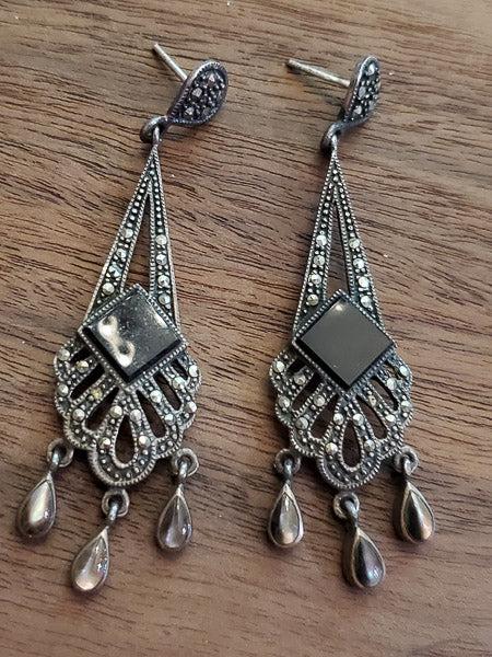 Sterling Silver Marcasite Chandelier Earrings: Ã‚ Please see the pictures for full details as this is the exact item you will receive.Ã‚ Measurements:Ã‚ They have a 68mm drop and are 17mm wide. One or two marcasites need to