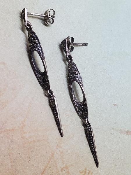 Marcasite and Sterling Silver Earrings: Please see pics for details as this is the exact item you will receive.Ã‚ Item Details: These have a 49mm drop and are 5mm wide Weight in Grams: 2.71 Hallmarks & Stamps Include: 925 Due to the 