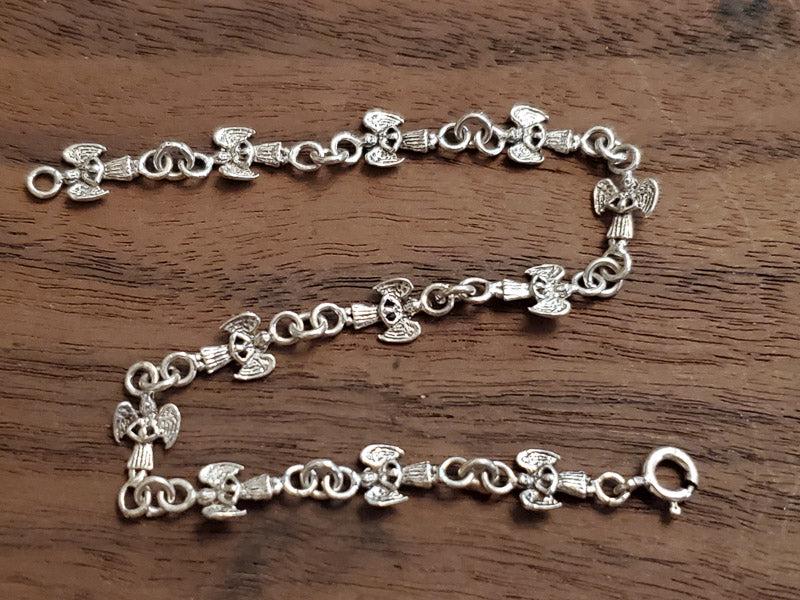Sterling Silver Angel Link Bracelet: Please see pics for details as this is the exact item you will receive.Ã‚ Length: 7.5 Inches and 6.3mm wide Weight in Grams: 3.84 Hallmarks and Stamps: 925 Due to the limited amounts of cleaning an