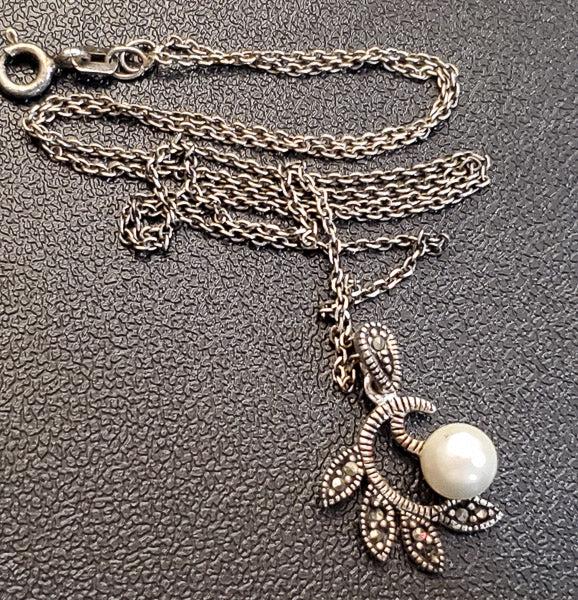 Marcasite Sterling Silver Necklace: Please review the pictures in detail as they are a major part of our description. The item pictured is the exact item you will receive. Length: 18 Inches and Pendant has a 21mm drop and is 13mm wide W