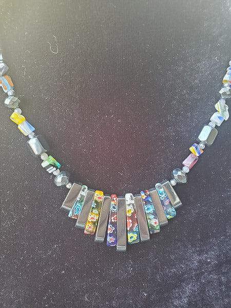 Millefiori Glass and Hematite Necklace: Please review the pictures in detail as they are a major part of our description. The item pictured is the exact item you will receive.Ã‚ Length: 18 InchesÃ‚ Details: Appx 27.5mm at widest Hallm
