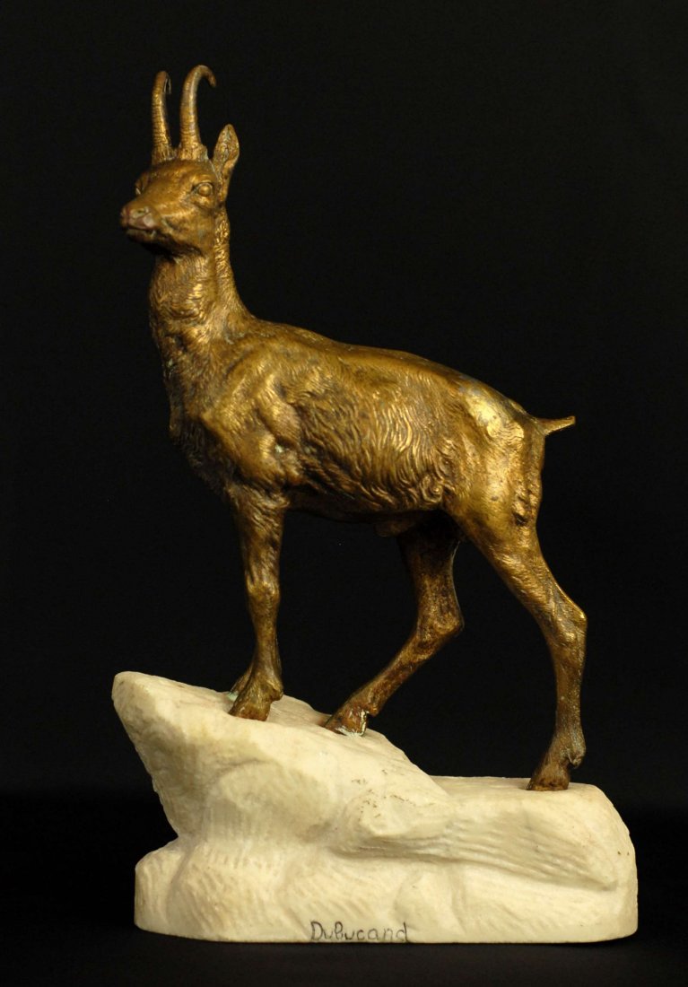 A BRONZE ANIMALIER CHAMOIS SCULPTURE, AFTER A. DUBUCAND: A BRONZE ANIMALIER CHAMOIS SCULPTURE, After Alfred Dubucand (1810-1879, French) on a carved white marble rocky groundwork base, incised DuBucand, Height: 11", Width: 7.5", Depth: 3"