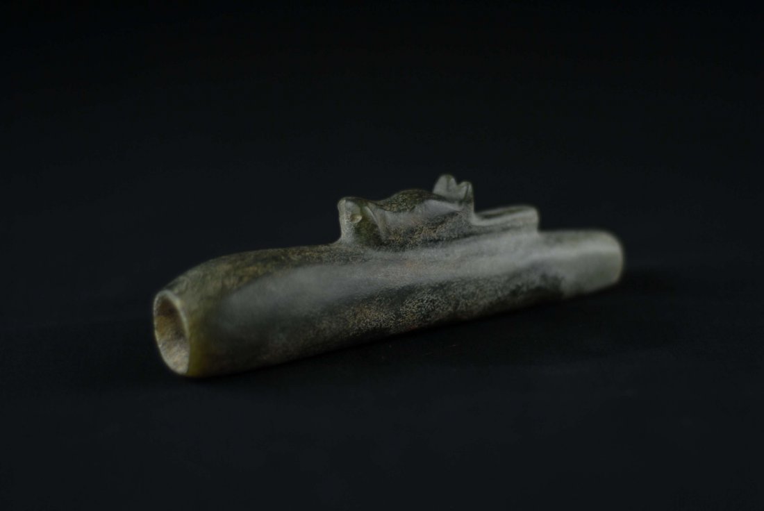 A HONG SHAN HARDSTONE CULTURE PIPE: A HONG SHAN HARDSTONE CULTURE PIPE, decorated with a resting animal head with incised nostrils and carved ears. meausring Height: 5.25", Width: 1" Depth: 1"