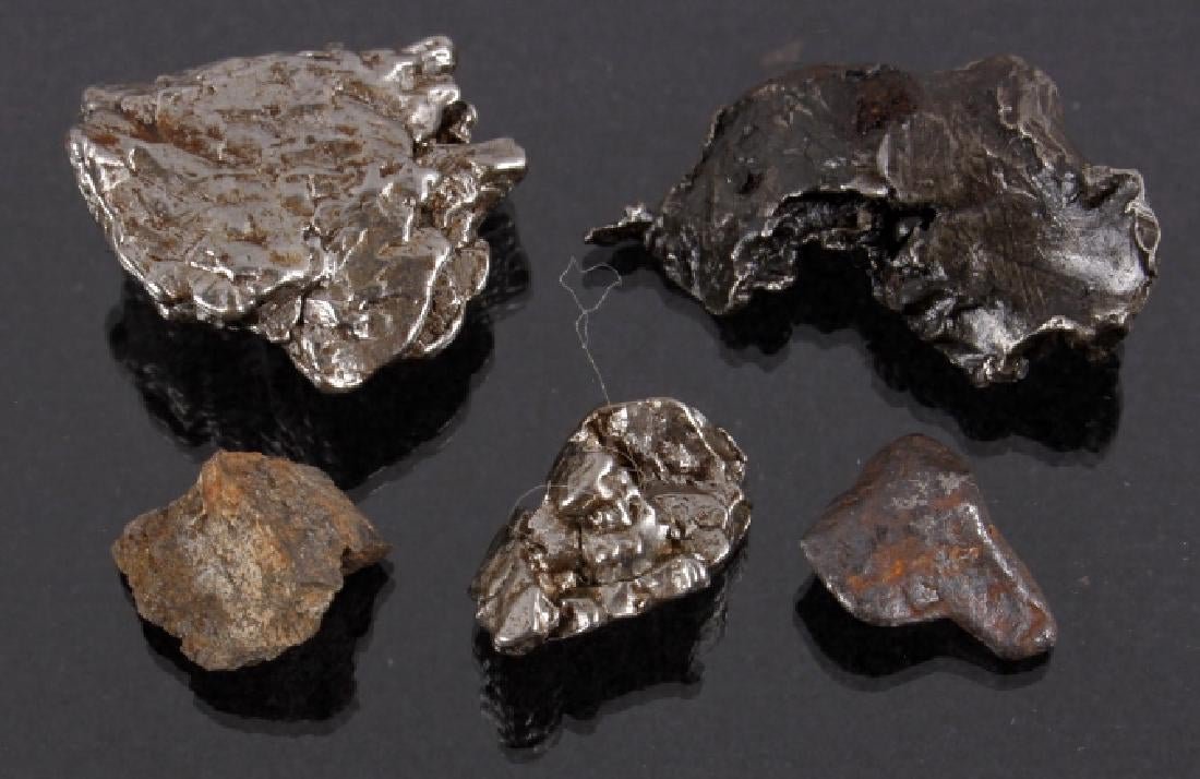 Collection of Meteorite Fragments: Collection of Meteorite Fragments For bidding in this lot is a collection of five meteorite fragments, all collected from four separate astrological events. The largest piece comes in the form o