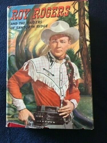 1946 ROY ROGERS AND THE RAIDERS OF SAWTOOTH RIDGE: 1946 ROY ROGERS AND THE RAIDERS OF SAWTOOTH RIDGE ROY ROGERS AND TRIGGER IN EXCELLENT CONDITION, SOME WEAR MARKS AND SLIGHT MISSING PIECE IN LEFT BOTTOM. PUBLISHED IN 1946. GREA