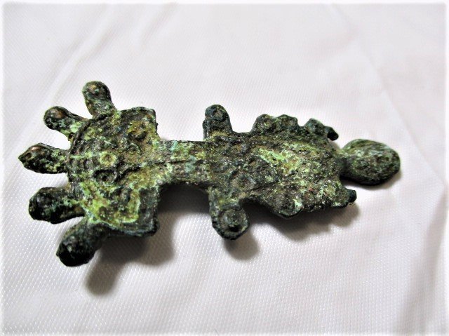 500 AD High status Frankish Bronze Fibula brooch: 500 AD High status Merovingian Frankish, Bronze Fibula brooch A fibula is a brooch or pin for fastening garments, typically at the right shoulder. The fibula developed in a variety of shapes, but all 
