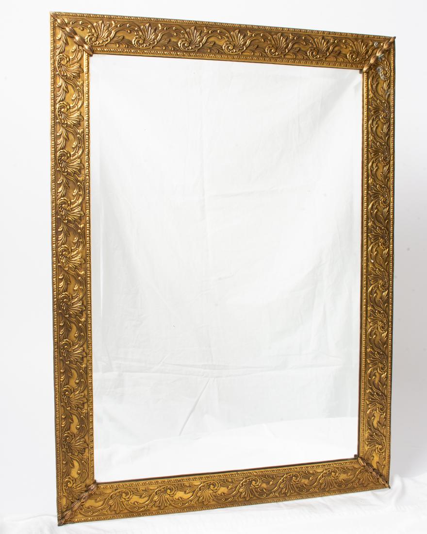 Antique Mirror with Gold Gilt Brass Frame 26.5x19.25": Description: Antique wall hanging mirror in brass frame with gold gilt painted finish. Rectangular with beveled edge mirror glass. Measurements: 26.5" Tall x 19.25" Wide