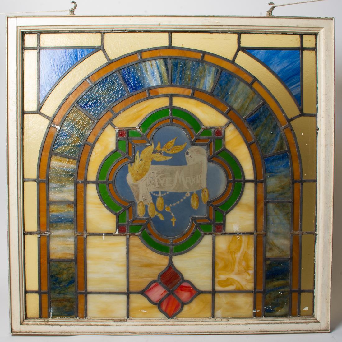Catholic Church Salvage Stained Glass Ave Maria 34.5": Description: Antique framed and leaded stained glass panel featuring a central Ave Maria. This panel was removed from a Catholic Church in San Francisco in the middle of the 1980s wile earthquake retr