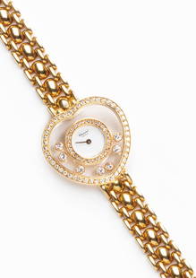 Chopard: orologio in oro e diamanti cassa a cuore, quadrante bianco, decoro in diamanti, movimento al quarzo Peso gr 52,50 lungh cm 17