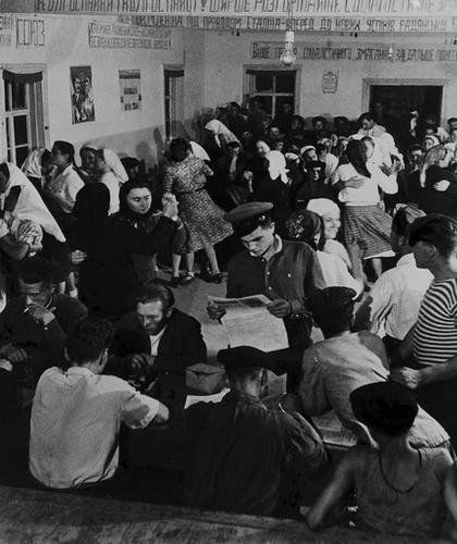 Robert Capa (1913-1954) Russia. Scenes Steinbeck S: Robert Capa (1913-1954) Russia. Scenes Steinbeck Series, 1947-48Gelatin silver print. Titled in ink with newspaper caption on the verso. 22.3 x 18.8 cm. (8 3/4 x 7 3/8 in.)(1)