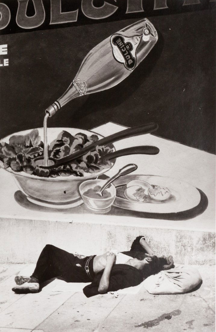 Brassai (1899-1984) Qui dort dîne, ca. 1935: Gelatin silver print, printed 1990 by Yvon Le Marlec. Dated in black ink and Yvone Le Marlec credit stamp on the versocm 36,5 x 23,8 (14.4 x 9.4 in.)Stampa alla gelatina sali d’argento, stampata nel