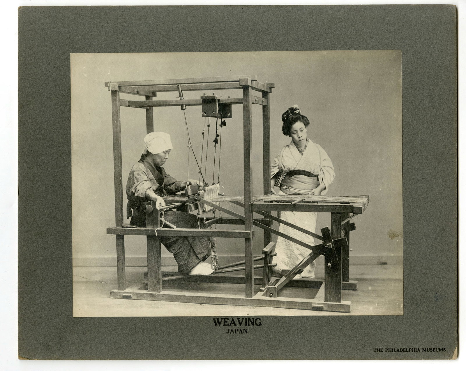 The Philadelphia Museum,Weaving - Japan, Silver gelatin photograph: Title: Weaving - Japan Artist: The Philadelphia Museum Silver gelatin photograph, 1910s. Image size 9 1/2 x 12" (241 x 304 mm). The loom shown in this photograph is one of the primitive hand-and-foot 