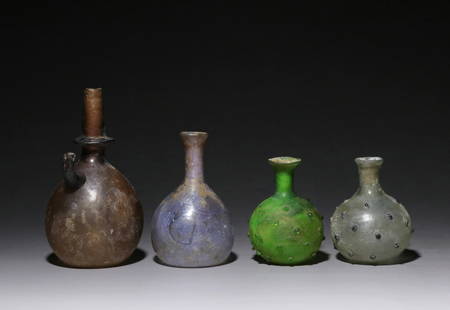 A set of glass bottles: H: 5 3/8 in(13.8cm) D: 3 1/8 in(8cm)