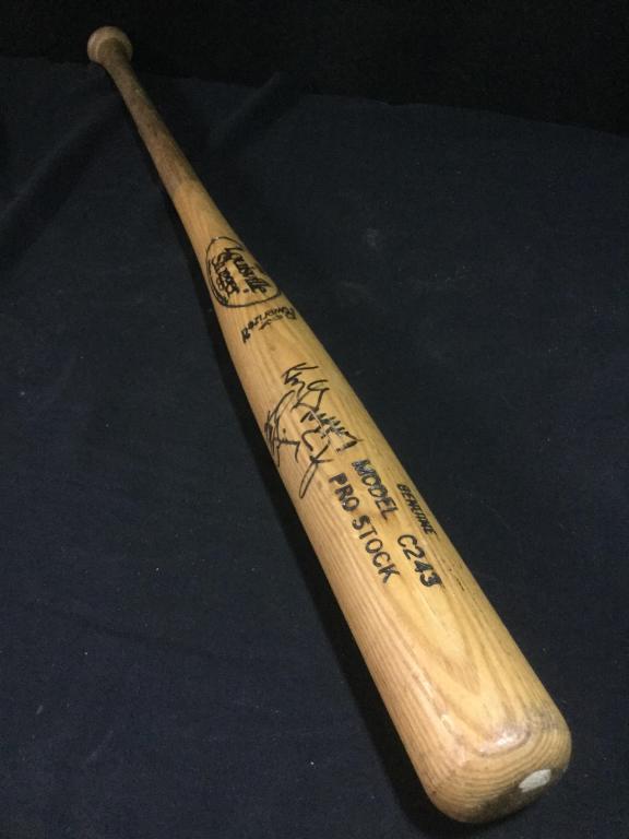 Autograph Bat: Signed by Ken Griffey and Ken Griffey Jr.. Bat measures 34" long. Louisville Slugger Model C243 Pro Stock. See pictures.