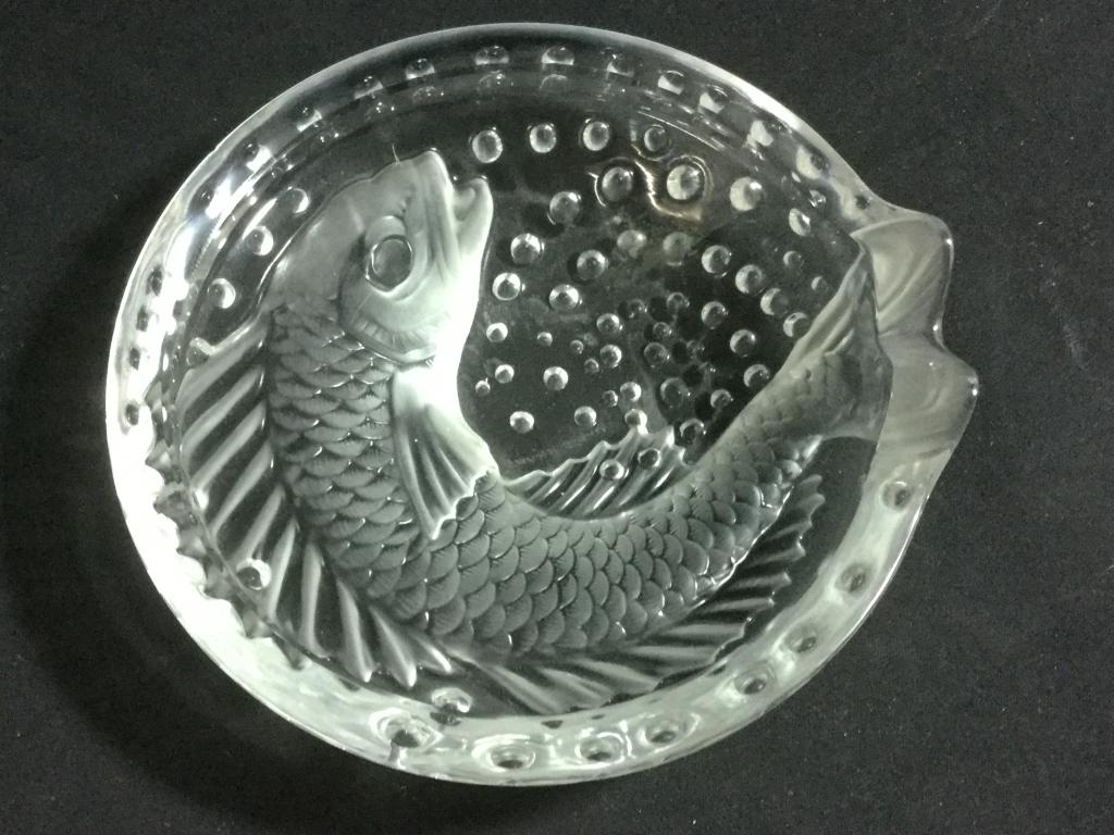 Lalique France Concarneau Koi Fish Cigar Ashtray: This has a fish and bubble design, koi fish. Measures 6 1/8" in diameter and is 1 7/8" tall. No chips, cracks. Value 100.00-175.00