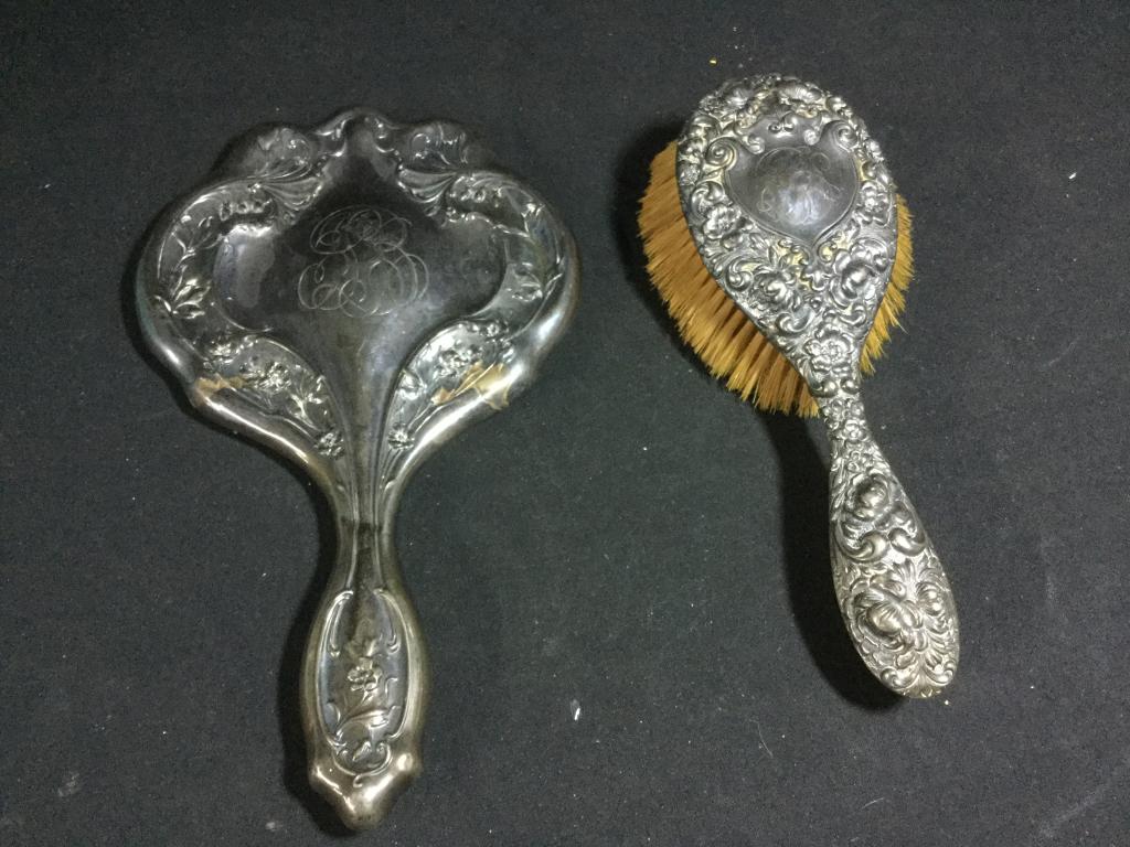 Vintage Sterling Mirror & Brush: Sterling Brush measures 8 1/2" l and the sterling mirror measures 10". Both pieces have wear on them due to age but are in good condition. Value 40.00-75.00