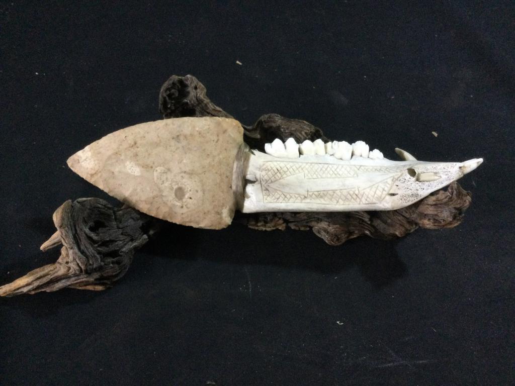 Handmade Knife with carving: Piece sits in piece of driftwood perfectly. Handle of knife is made out of animal bone with carvings and knife is hand napped flint (10.5"x3"w).