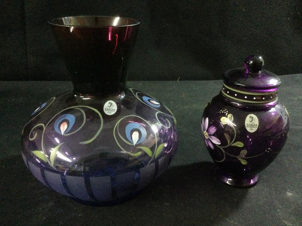 Signed Hand Painted Fenton: Total of 2 pieces. The larger purple vase is hand painted and #318/1250. Signed by artist and 9 members of the Fenton family. Measures 8"h. The smaller purple hand painted candy dish with lid signed b