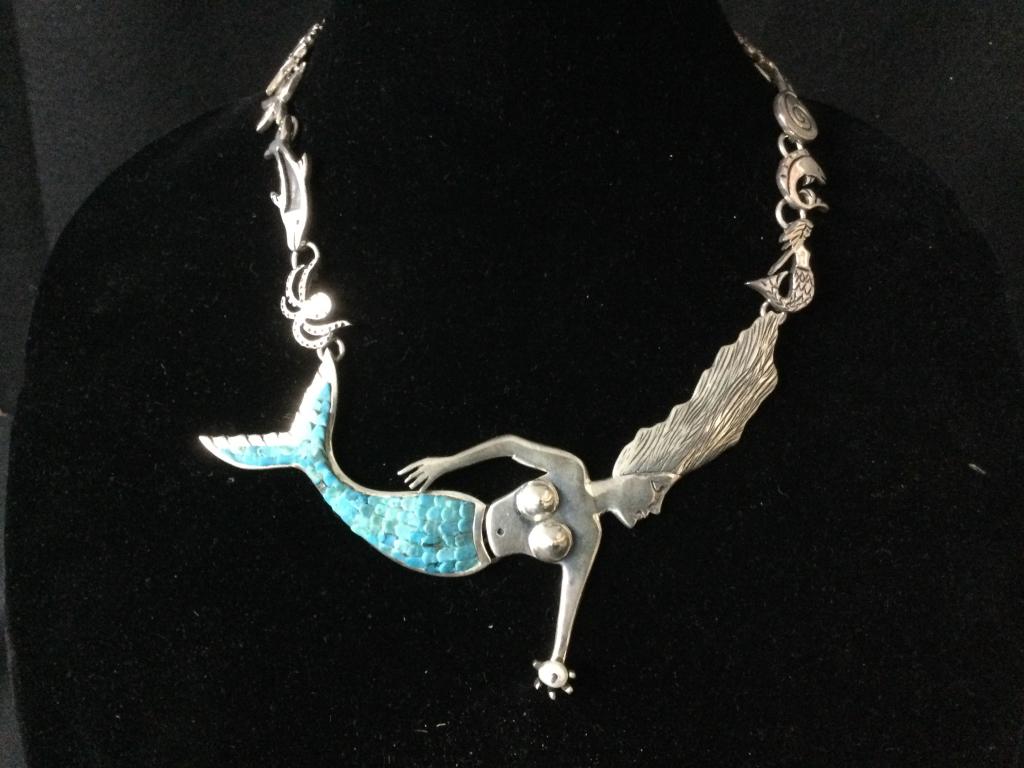 Sterling Designor Mermaid Necklace Signed: One of a kind beautiful piece with turquoise "Pachamama". Total weight is 107.5g & measures about 18"l. There is dolphins, crabs, sea horses, octopus, star fish & fish, turtle & more on this piece bes