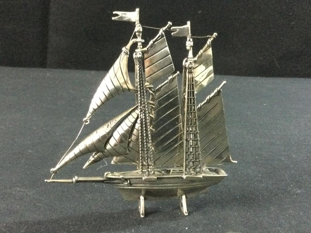 Sterling Silver Sail Boat: Intricately made awesome Sail Boat that weighs 62.7g. Measures 3.5"w x 3 3/4"h. In great condition, detail detail.