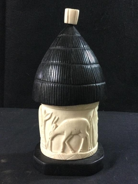 Carved Tusk & Ironwood: Another great estate piece. This tusk was hollowed out to make a covered bowl like a hut with carvings on the outside. The tusk measures 4"h x 4 1/2"w x 13" perimeter around tusk. The top/cover is mad