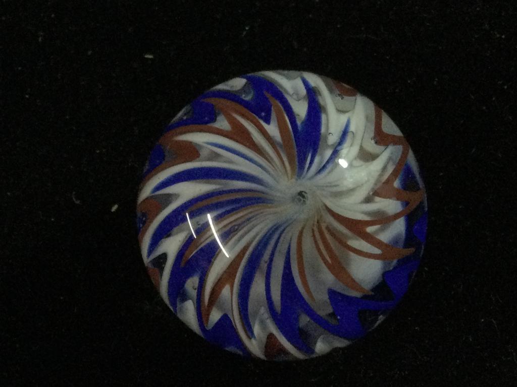 Large Hand Made Sam Hogue Glass Marble: Sam Hogue marble In great condition with no chips or cracks. Measures 5" around and color is red, white & blue swirl. Absolutely stunning.