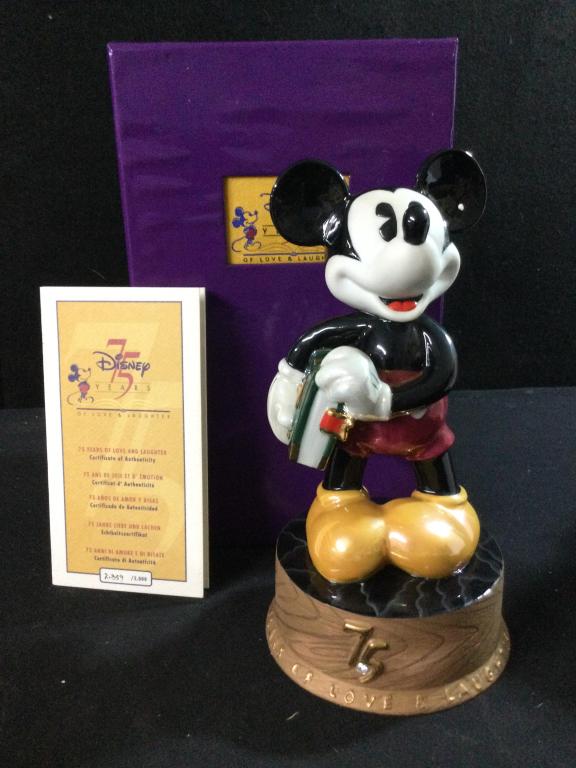 Disney 75 Years Of Love & Laughter Mickey Mouse: Glazed porcelain figurine that is LE #2859 of 5000. Marked on bottom commemorating 75 years for Walt Disney Co. No chips or cracks. Measures 9"t x 5"w.