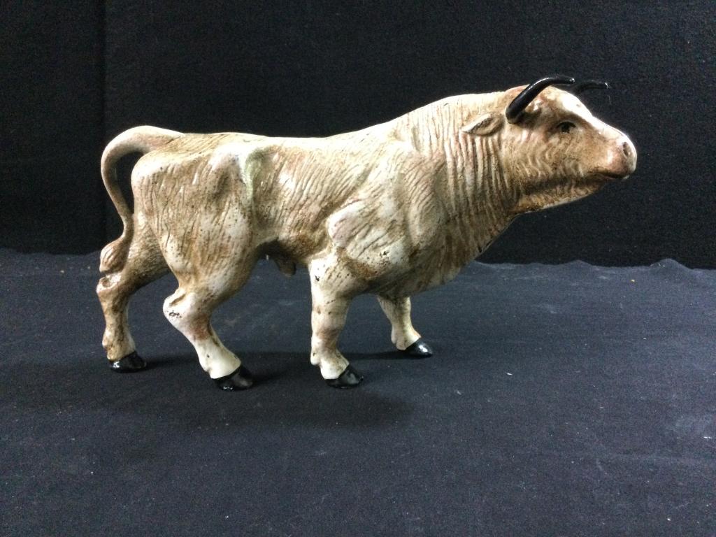 Cast Iron Bull: Neat cast iron bull. door stop. Measures 5 3/4"h x 11"l x 2 1/2"w. In good condition.