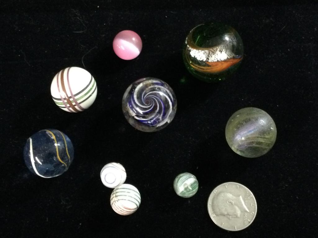 Antique Marble Lot: Total of 9 marbles in different sizes. They are in good condition, with no chips. See pictures.