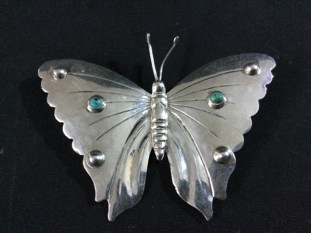 Navajo Butterfly Brooch: Has turquoise on wings and signed. Measures 2.5"l x 3.5"w & weighs 18.0g. In good condition.