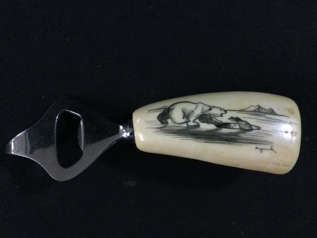 Scrimshawed Whale Tooth Opener: Signed scrimshaw whale tooth of polar bear attempting to catch a fish. In great condition. Measures 5.5"l.