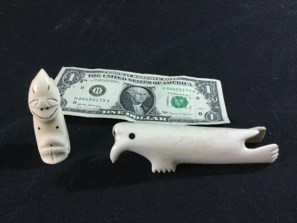 Carved Alaskan Pieces: There is a billiken that measures 2.5"l. The other piece is shaped like seal carved from whale bone. It measures 4.5"l. Both in good condition.