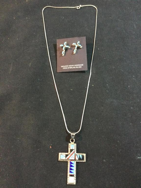 Sterling Zuni Cross Jewelry: In this lot is a pair of earrings w/turquoise. Then there is a silver chain with Zuni cross pendant. All in good condition.