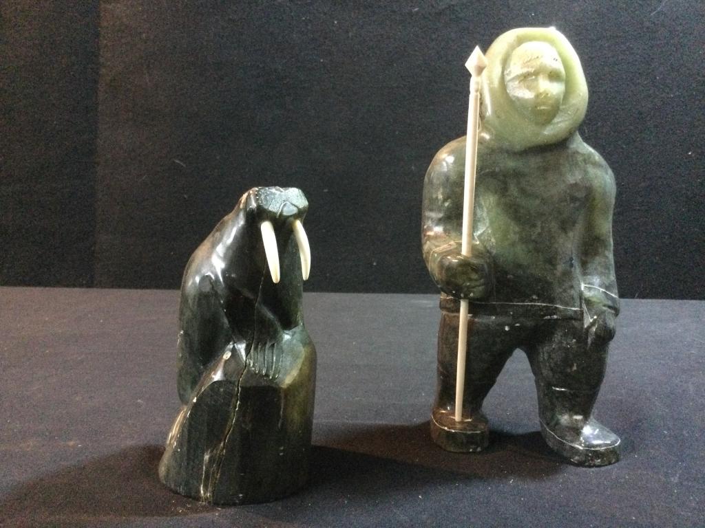 Carved Alaskan Figures Soapstone: Carved soapstone Seal Figure measures 4 3/4"h and the Eskimo measures 7.5"h. Both signed on bottom and in good condition.