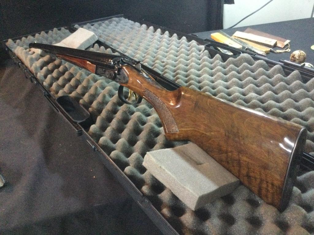 John Wayne LE Coach Gun: Double barrel side by side 12 ga., 2-3/4 in. chambers, 18-3/4 in. barrels, Edition number "JW-1821" inscribed in gold in front of trigger guard, top of barrel rib "United States Society of Arms and Ar