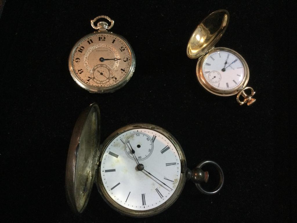 Vintage Pocket Watches: ttoal of 3 in this lot. One is a Elgin. The other is a Hamilton missing glass cover and the other is coins silver. See pictures. Value 80.00-200.00