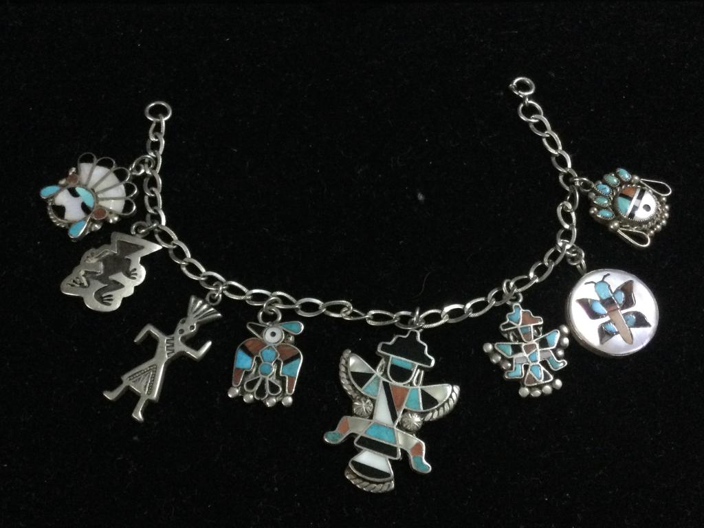Navajo Charm Bracelet: Measures 6 1/2" l and has 8 charms on it. In great condition. Weighs a total of 26.0g.