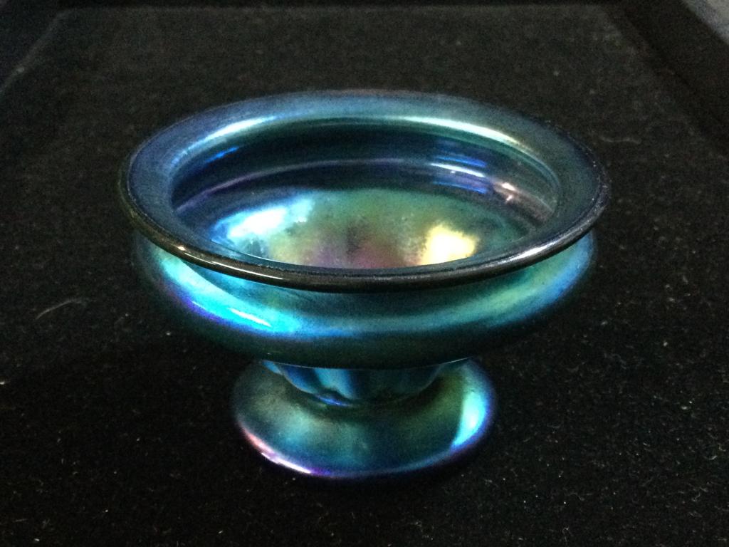 Tiffany? Art Glass: Unsigned Tiffany or Tiffany style art glass salt cellar. Measures 2 3/4' high x 1 2/4' wide. Beautiful piece. It is in perfect condition. Value 150.00-400.00