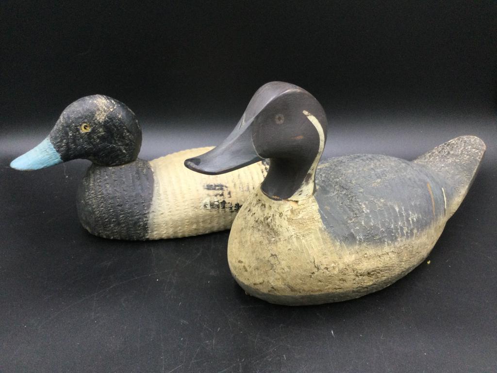 Vintage Duck Decoys: Two vintage duck decoys. One measures 13.5"l x 6 3/4"h x 4.5"w. The other is 15"l x 8.5"h x 5"w value 125.00-250.00