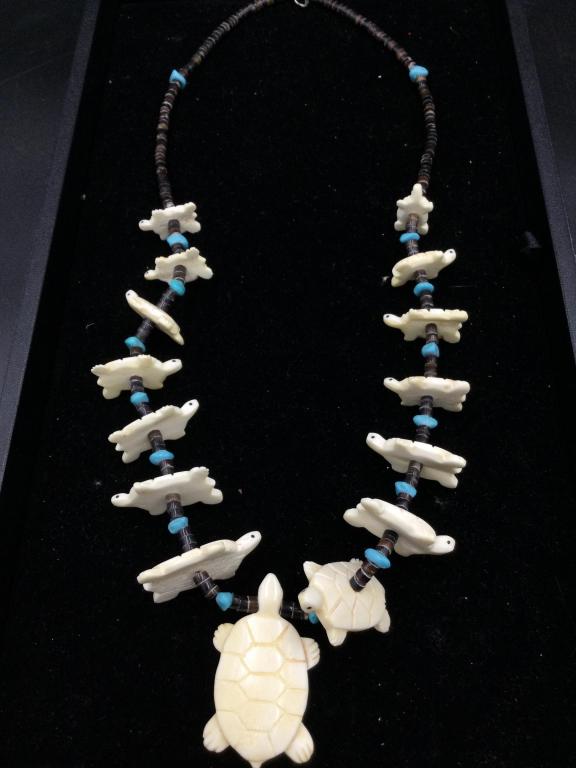 Zuni Hand Carved Turtles Fetish Necklace: Neat larger turtle fetish necklace that measures over 28"l. Has approximately 15 carved turtle. It is on a heishi bead necklace with turquoise nuggets. In good condition no hips or cracks.