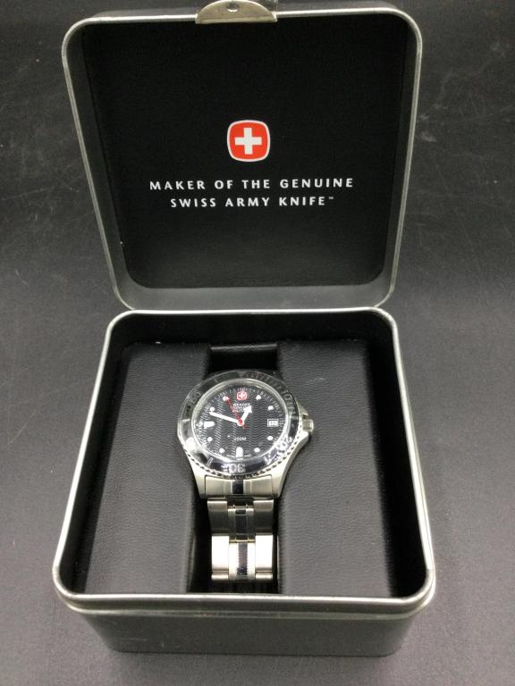 Wenger Swiss Military Watch: Comes in original box missing piece watch sits on. In good condition, see pictures. Value 50.00-100.00