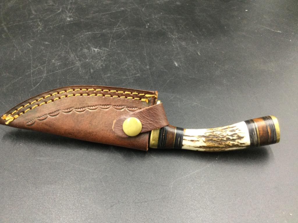 Stag Handle Damascus Steel Knife w/Sheath: Hand made stag handle Damascus steel knife. Measures just under 8" overall and blade is 4" long.