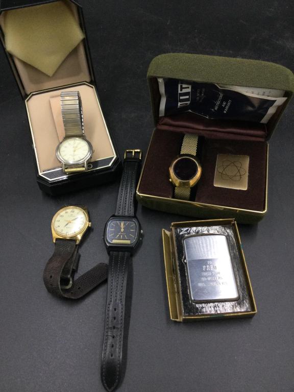 Vintage Watches & Lighter: Total of 4 watches, 2 in original boxes. There is also a lighter, see pictures. Please carefully read our terms of sale, shipping & condition reports prior to bid.